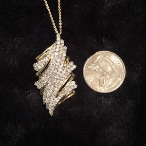 Large diamond and gold pendant.